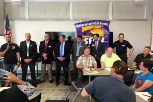 MERRIMACK VALLEY FORUM: Local 888 member Pedro Ayala, left, speaks up as legislative candidates listen. Seated in front, from left, are Local 888 leaders Fred Simmons, Mike Kelly, Tom McKeever and Darcie Boyer.