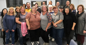 ON THE UNION BUS: Leaders are looking to take the Haverhill Transportation Group to new heights. Front row from left, Gail Pelitier, treasurer; Gigi Terranova, chapter co-chair; Cindy Gouldsbrough, chapter co-chair; Beth Chasse, secretary; Michelle McCarthy, steward; and Rosalida Mendez, chief steward. And; second row in the yellow shirt, Gustavo Rivera, steward.