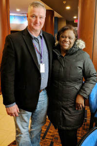 TIME OF NEED: Marcelina Johnson appreciates the support she has gotten from her union after fire hit her home, right, on New Year’s Day. She is shown here with Local 888 Secretary-Treasurer Tom McKeever.