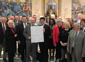 LABOR SAVORS VICTORY: Local 888 President Brenda Rodrigues, at far right, was on hand to celebrate a new law that will require employers to allow union leaders to give an orientation to new hires. 