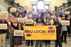 STANDING TALL: MassDefenders and supporters rally at the State House, pressing the Legislature to amend the state’s collective bargaining law.