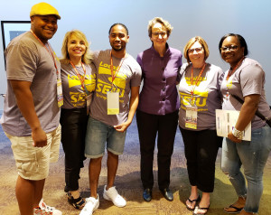 TOGETHER WE RISE: Local 888 leaders were on hand with SEIU President Mary Kay Henry, third from right, for the international’s Unions for All Summit in Los Angeles. From left are Local 888 Executive Board members Emmanuel Marsh, Teresa Riordan, Kevin Nascimento, President Brenda Rodrigues and LaToya Weaver. For summit highlights, see video: https://youtu.be/Mq6yq4_tTw8.