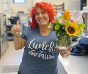 'LUNCH LADY SQUAD': Lisa Mather at Brockton's Angelo Elementary School wears a special T-shirt to celebrate Food Service Workers' Recognition Week. 