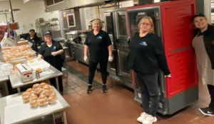 ALWAYS ESSENTIAL: The Marlborough cafeteria staff is working away in the kitchen. With the COVID-19 crisis, they are making lunches and breakfasts that are delivered to bus stops for the city's children.