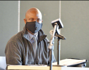 TRYING TIMES: Local 888 leader Kwesi Ablordeppey testifies at Holyoke Community College for the Legislature’s special committee on the Holyoke Soldiers’ Home outbreak.