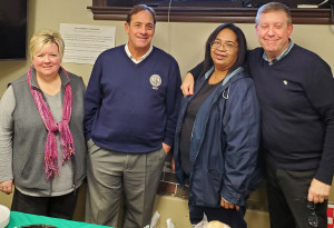 RATIFICATION CELEBRATION! Members of the Chelsea City Hall negotiation team take a break after a successful vote for a new contract. They are, from left: Paulette Velastegui, Richard Zullo, Naomi Libran and Scott Bridges. 
