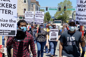 ‘BLACK WORKERS MATTER’: Workers at College Bound Dorchester and their supporters march to protest the firing of staff members.