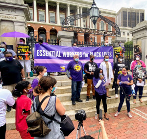 TAKING IT TO STATE HOUSE: SEIU members took part in a recent Boston rally that spotlighted essential workers, who are often black and Latinx, and demanded economic justice for all. 
