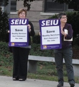 Brenda Rodrigues and Gail Silva picketing at Westborough selectmen's meeting