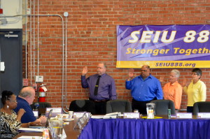 Nine board members were sworn in at the Local 888 Executive Board meeting on May 20. Shown in the picture above taking the oath of office are Fred Simmons, Haverhill School Custodians; Charlie Mays, Boston Public Health Commission; Susan Winning, UMass Lowell; and Gail Silva, Westborough Town Hall.
