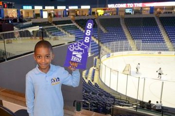 A young hockey fan gives Local 888 a thumbs up at our first-ever Hockey Night at UMass Lowell.  