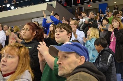 Local 888 members cheer the action on the ice. More than 250 area workers attended the event.