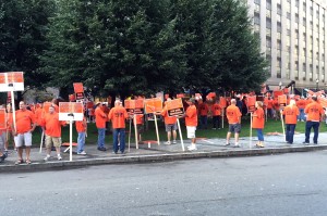 Members of the Carmen’s Union protested outside of the hotel where President Obama spoke on Labor Day. The largest labor group at the MBTA says that a plan to privatize certain bus routes is the first step on the way to diminishing service and increasing fares.