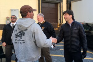 Jonathan Dudley (at right), congratulates a locked-out Aubuchon Hardware warehouse worker just prior to giving him a Thanksgiving turkey. 