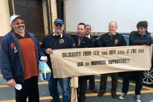 Jonathan Dudley (at far right) was joined by Teamster Local 170 leaders and Winchester labor activist Ken Marian at the Thanksgiving turkey distribution. 