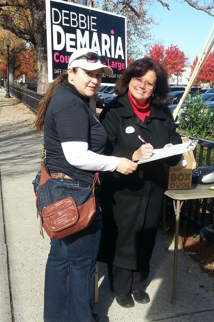 Local 888 organizer Christina Villafranca gathered signatures on election day for the Raise Up Massachusetts campaign in Malden.  She's shown here with victorious Malden City Council candidate Debbie DeMaria.
