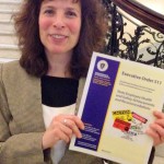 Marcy Goldstein-Gelb, executive director of the Massachusetts Coalition for Occupational Safety and Health pictured with a copy of the Advisory Committee's new report