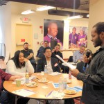 Jonathan Stroud (Brockton) stood to ask a candidate a question.  With him at the Local 888 table was Mike Kelly (Lottery), Lorna  Heron (Boston DND), Jorge Vargas (Boston Public Schools), Kwesi Ablordeppey (Holyoke Soldiers Home), and Margarita Franco (Chelsea).  