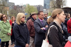 Mark DelloRusso listening as the names of workers killed on the job in 2013 are read.  