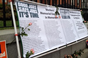 Workers' Memorial Day banner with the names of workers who were killed on the job in 2013. 