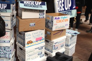 Boxes containing the more than 155,000 signatures gathered in support of a “millionaire’s tax” to support education and transportation.