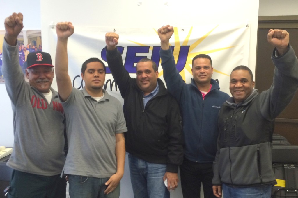 A group of 15 parking lot attendants who work for the City of Lawrence got fed up with favoritism and wanted job security. They used “majority signup” to gain recognition for their union on May 26. Left to right in the picture are Roman Brito, Jose Luis Santiago, Carlos Morel, Pedro Ayala, and Dario Made. Under Massachusetts law, if a majority of employees sign cards to demonstrate their desire to form a union, the union can quickly win legal recognition.