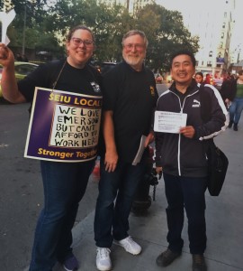 Emerson Local 888 members Richelle Devereaux-Murray, Dennis Levine and Elbert Lee joined the informational leafletting action.